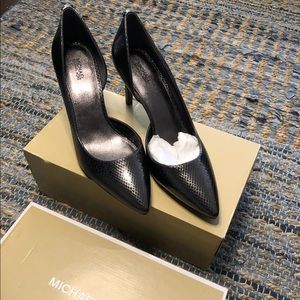 Brand new. Never worn. Michael Kors. Metallic Embossed Leather. Size 9.5